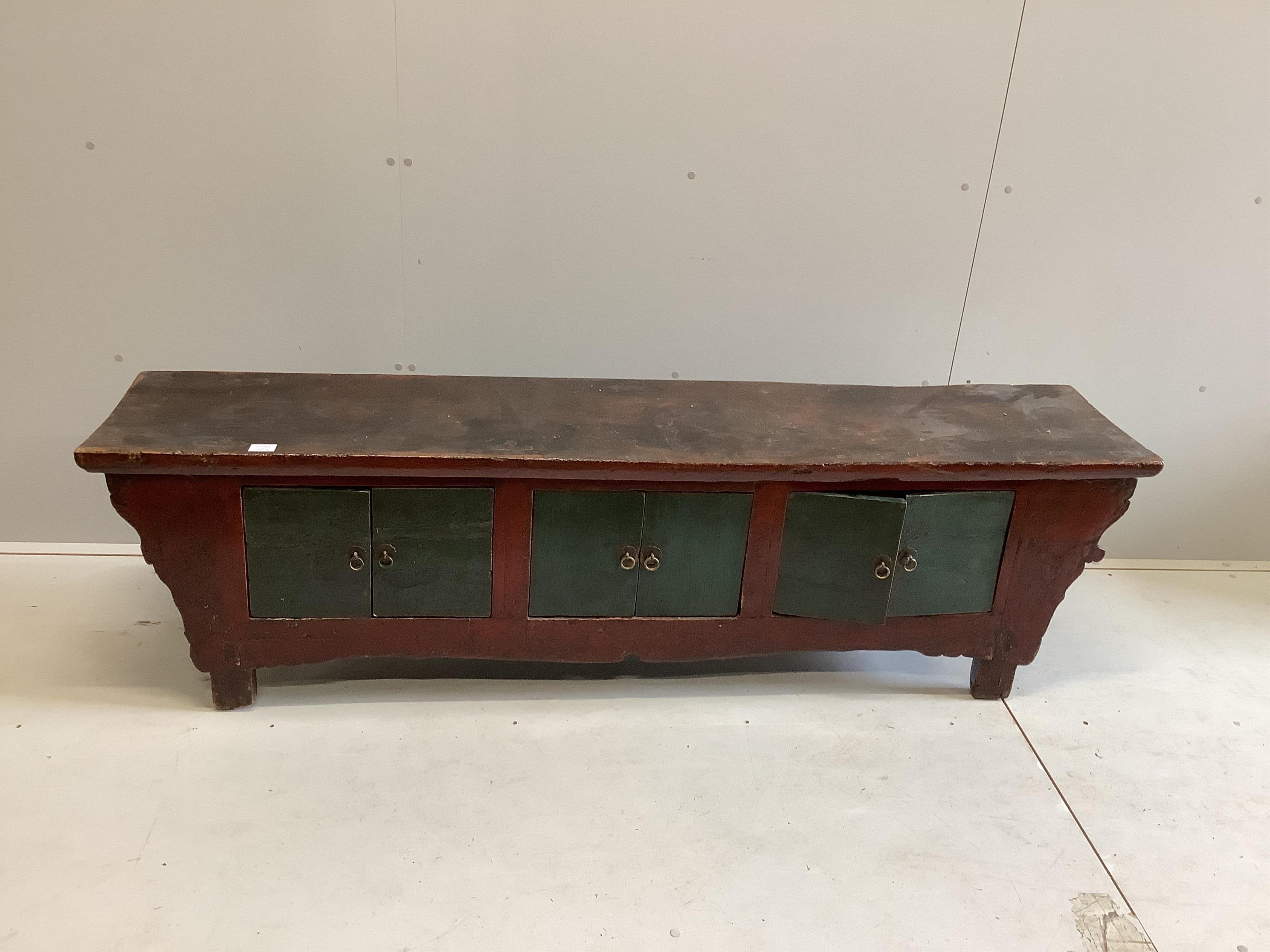 A Chinese painted low hardwood cabinet, width 185cm, depth 38cm, height 52cm. Condition - fair